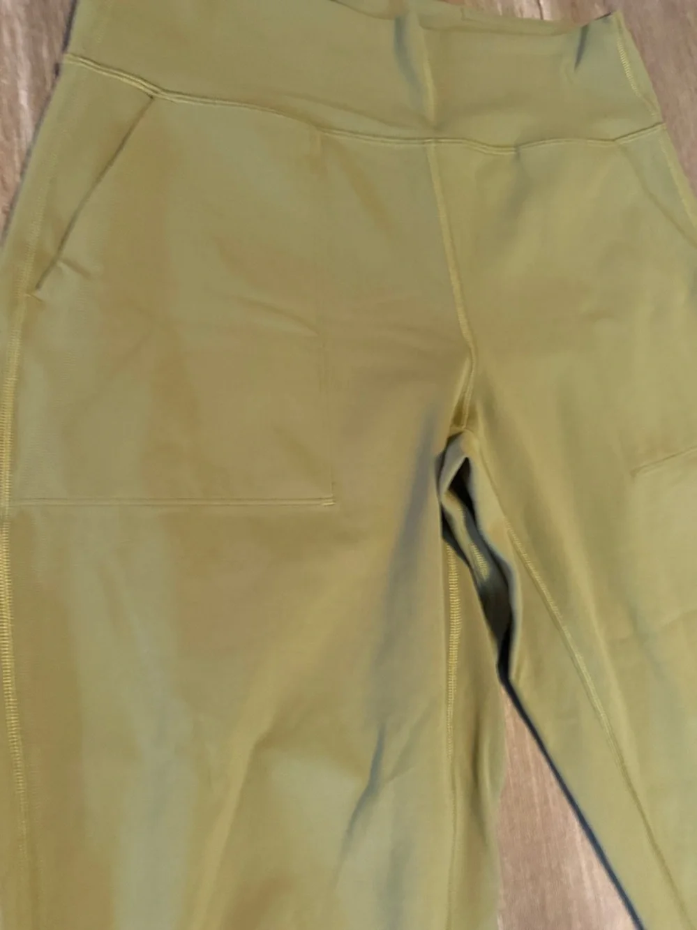 Lululemon Align High-Rise Cropped Jogger Capris in a bronze green color.